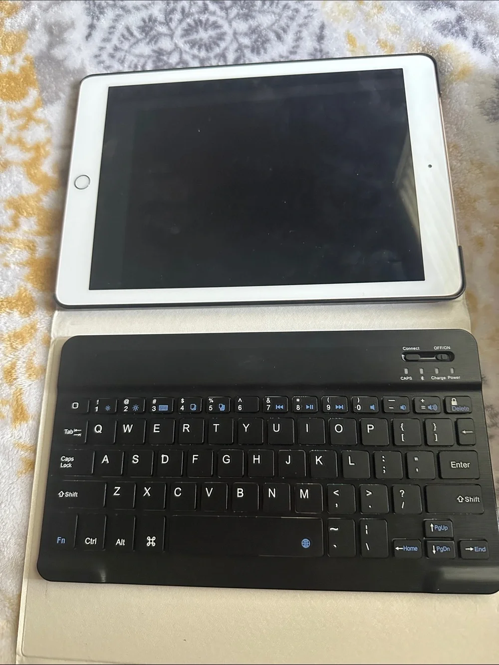 Apple Tablet with White Bezel and Black Bluetooth Keyboard Case